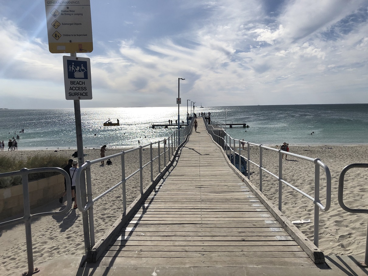 Family fun at Coogee Beach with a jetty., two water slide pontoons and a protected swimming area
